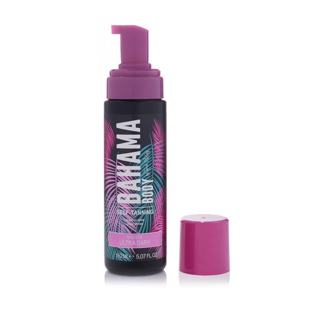 A pump bottle of Bahama Body self-tanning mousse with a pink cap, featuring tropical leaf designs on the label.