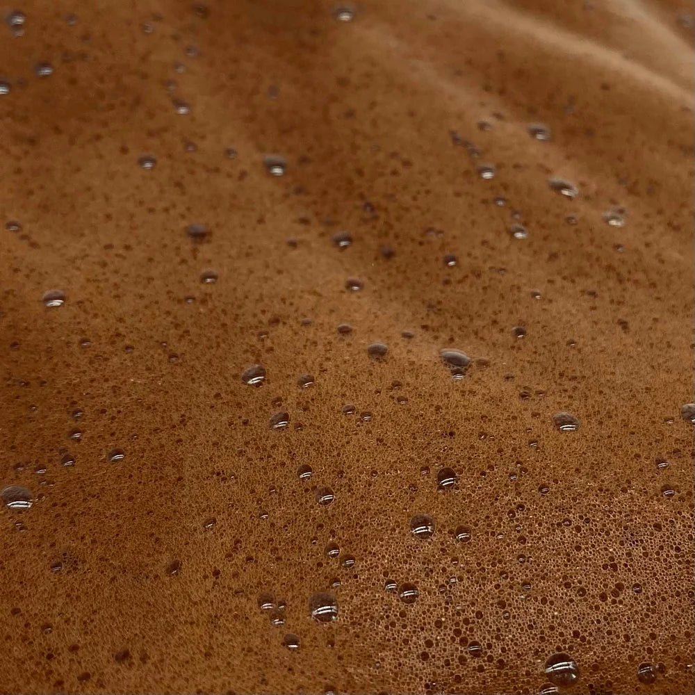 Close-up of a brown liquid with bubbles
